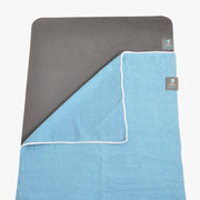 Get a Grip Towel - shown laid on top of a TRIBE Warrior yoga mat | TRIBE Yoga