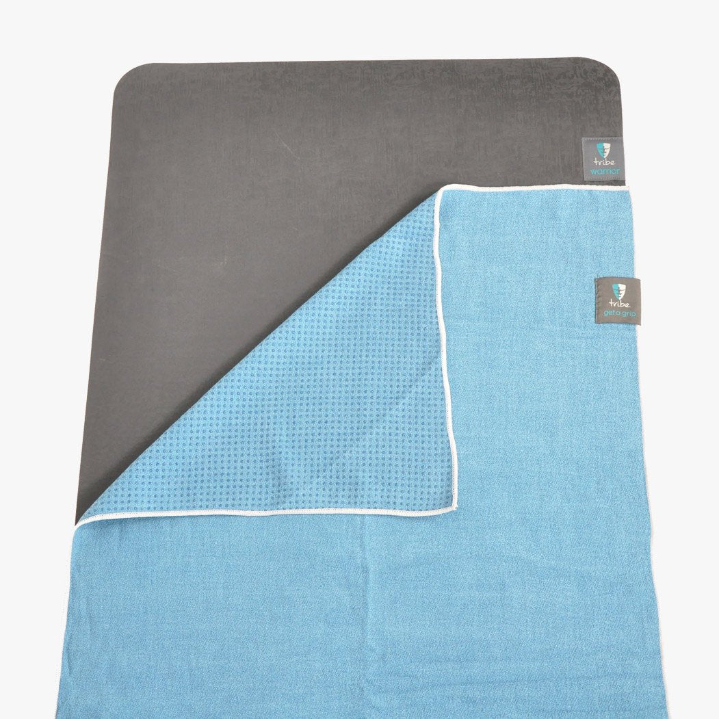 Get a Grip Towel - shown laid on top of a TRIBE Warrior yoga mat | TRIBE Yoga