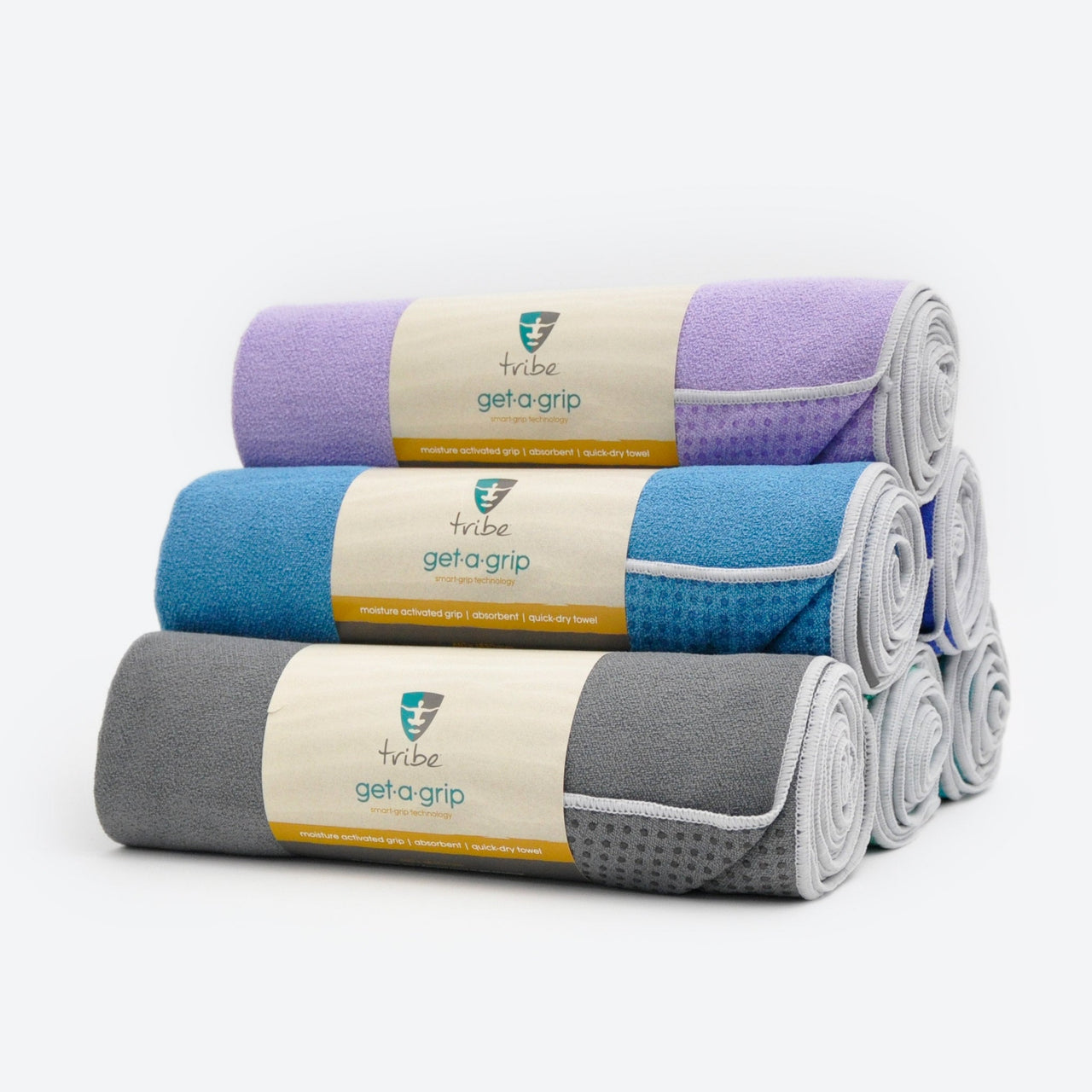 A pyramid of 6 Get-a-Grip yoga mat towels | TRIBE Yoga