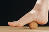 Cork Massage Ball - under the arch of right foot | TRIBE Yoga